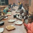 Youth attending Foyer Don Bosco, located in Porto-Novo, Benin, received a shipment of nutritious meals through a partnership between Salesian Missions